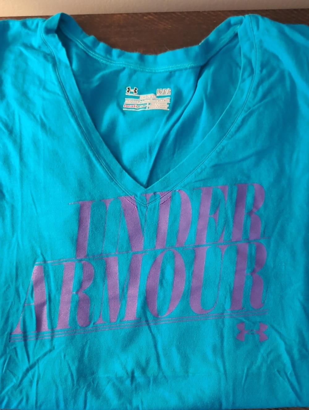 Under Armour Women’s Teal V-Neck Graphic Tee with Purple Logo